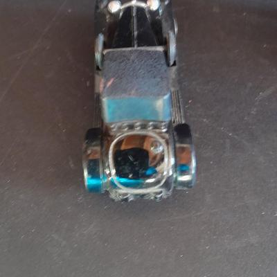 Motorcycle toy, radio flyer wagon, and black Riley MPH