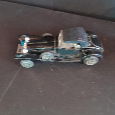 Motorcycle toy, radio flyer wagon, and black Riley MPH