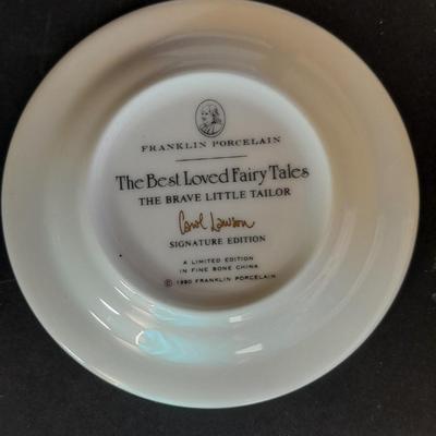 The Brave Little Taylor plate with story, and an Avon 10th Anniversary Plate in Box with paperwork