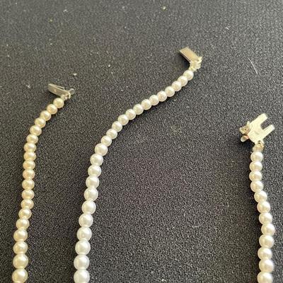 THREE FAUX PEARL NECKLACES AND EARRINGS