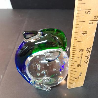 Beautiful blue and green glass Dolphin on clear base with vase of faux flowers