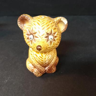 Four-piece lidded glass canister set on wooden Lazy Susan with vintage salt & pepper bear shakers