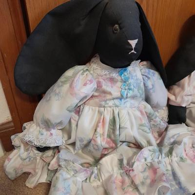 Wooden doll bench with two rabbits and a framed picture