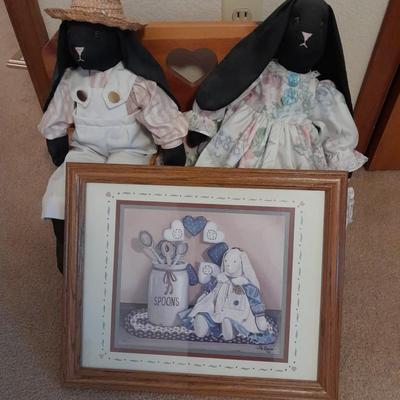 Wooden doll bench with two rabbits and a framed picture