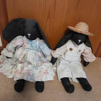 Wooden doll bench with two rabbits and a framed picture