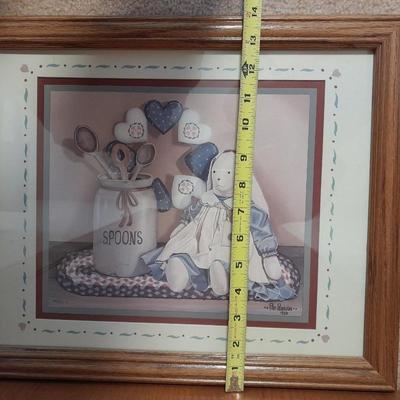 Wooden doll bench with two rabbits and a framed picture