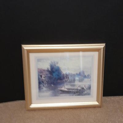 Two gold framed pictures