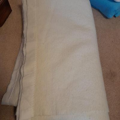 Three Polyester blankets with silk edging