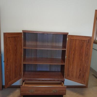 Tall wardrobe / storage cabinet with shelves inside doors and two drawers