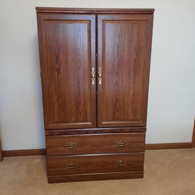 Tall wardrobe / storage cabinet with shelves inside doors and two drawers