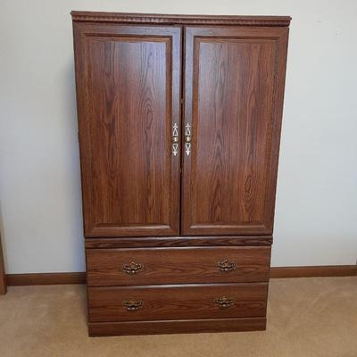Tall wardrobe / storage cabinet with shelves inside doors and two drawers