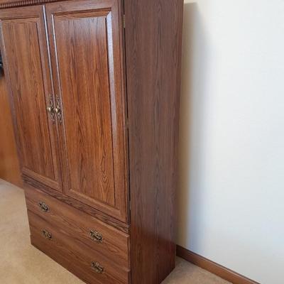 Tall wardrobe / storage cabinet with shelves inside doors and two drawers