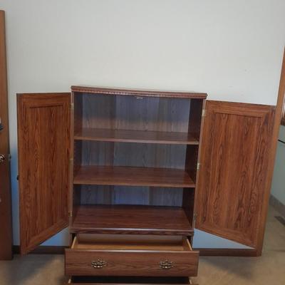 Tall wardrobe / storage cabinet with shelves inside doors and two drawers