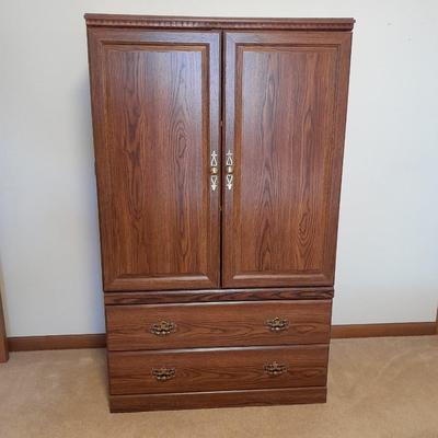 Tall wardrobe / storage cabinet with shelves inside doors and two drawers