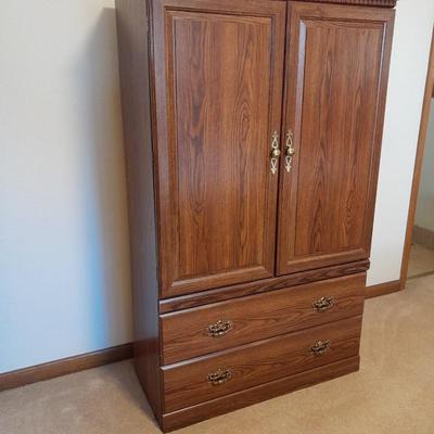 Tall wardrobe / storage cabinet with shelves inside doors and two drawers