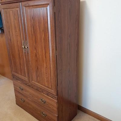 Tall wardrobe / storage cabinet with shelves inside doors and two drawers