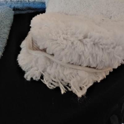 3 piece White Bath rug set with a few blue towels