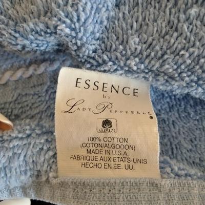 3 piece White Bath rug set with a few blue towels