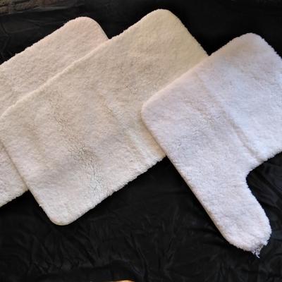3 piece White Bath rug set with a few blue towels