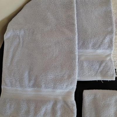 Bath rug with bath towels, hand towels and washcloths