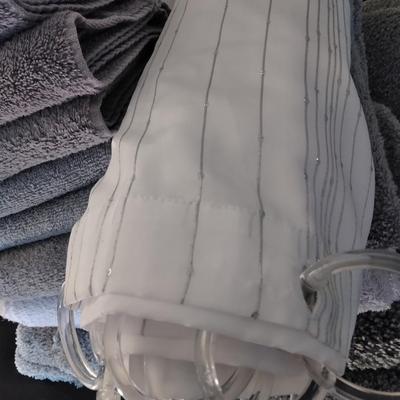 Three-piece Grey Bath rug set, Shower curtain with rod, and Bathroom Towel set