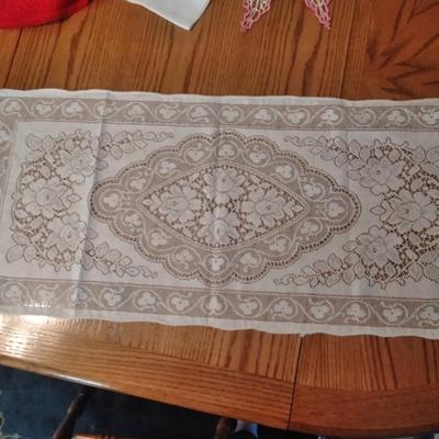 Doilies, round red with lace tablecloth and lace table runner