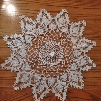 Doilies, round red with lace tablecloth and lace table runner