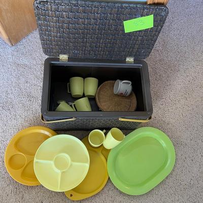 Vintage picnic basket with plasticware