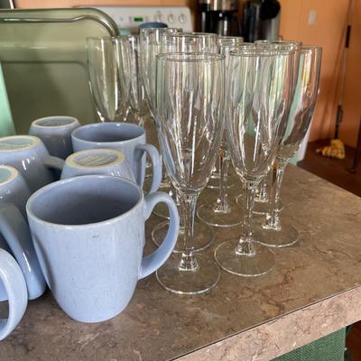 White plates Blue mugs champagne flutes. I