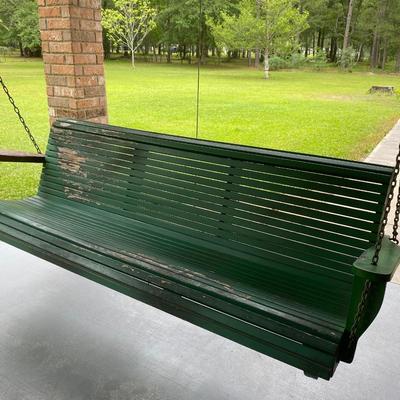 Vintage green wooden porch swing