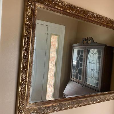 Large vintage beveled mirror with gilded Sirocco frame