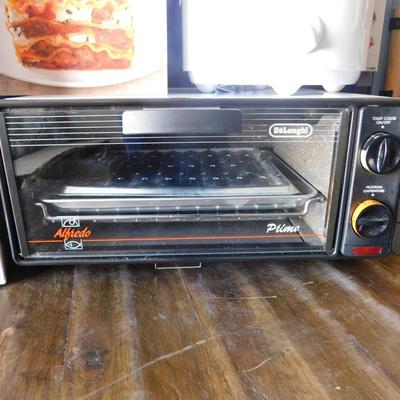 NEW RIVAL CROCKPOT AND TRAVEL CASE, SLOW COOKER REVOLUTION COOKBOOK AND NICE LITTLE PRIMO  TOASTER OVEN