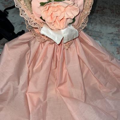 stuffed bear in pretty dress with hat on stand