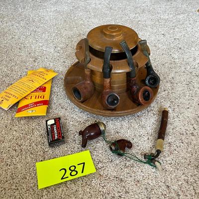 Pipe rack with vintage pipes.
