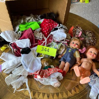 Box of dolls & Doll clothes