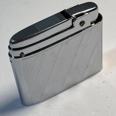 SHINY CHROME â€œSCHICKâ€ CIGARETTE LIGHTER