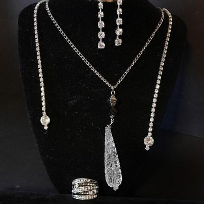 Necklace, Earrings, and a ring with an elastic band BLING!