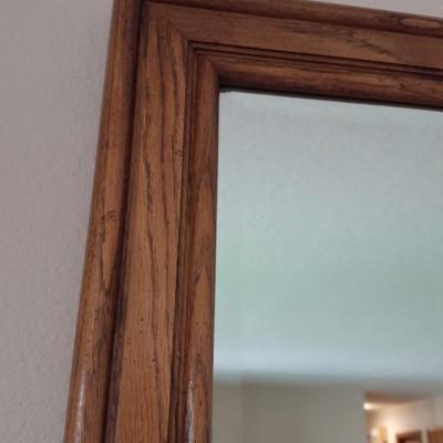 Large wood framed beveled glass mirror