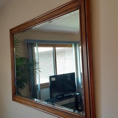 Large wood framed beveled glass mirror