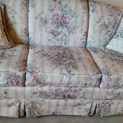 Beautiful Broyhill floral sofa with throw pillows and arm protectors