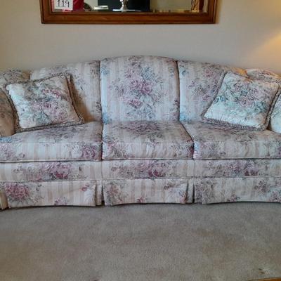 Beautiful Broyhill floral sofa with throw pillows and arm protectors