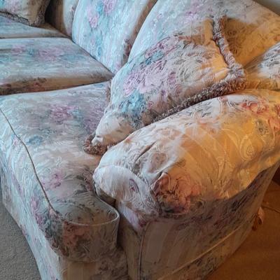 Beautiful Broyhill floral sofa with throw pillows and arm protectors