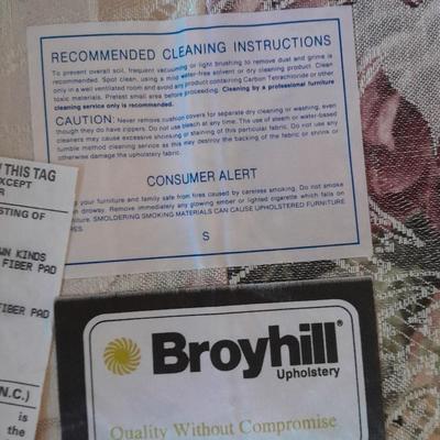 Beautiful Broyhill floral sofa with throw pillows and arm protectors