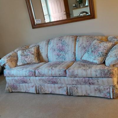 Beautiful Broyhill floral sofa with throw pillows and arm protectors