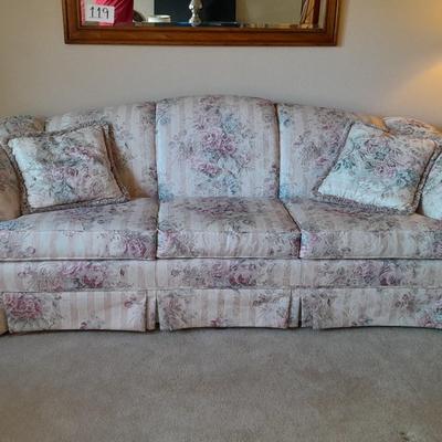 Beautiful Broyhill floral sofa with throw pillows and arm protectors