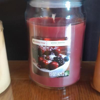 New, unburned Candles and candle sconces