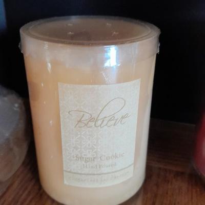 New, unburned Candles and candle sconces