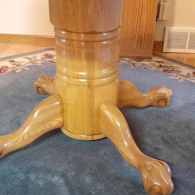 Beautiful Oak round claw footed pedestal Table with 4 chairs and a leaf
