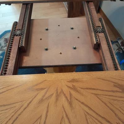 Beautiful Oak round claw footed pedestal Table with 4 chairs and a leaf