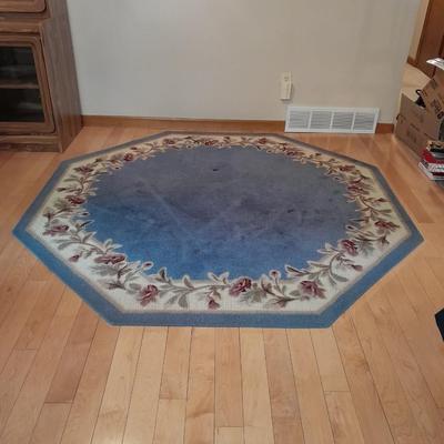 Octagon shaped blue and floral area rug